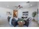 Beautiful living room featuring a neutral palette, fireplace, and views to the staircase at 3574 E Glacier Pl, Chandler, AZ 85249