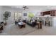 Inviting living room with french doors to backyard, bar, and neutral decor at 3574 E Glacier Pl, Chandler, AZ 85249