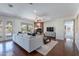 Living room with fireplace, hardwood floors, and access to outdoor area at 3574 E Glacier Pl, Chandler, AZ 85249