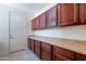 Pantry with tile floor and wood cabinets at 3574 E Glacier Pl, Chandler, AZ 85249