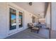 Inviting covered patio with double doors to the home, great for indoor/outdoor living at 3574 E Glacier Pl, Chandler, AZ 85249