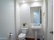 Charming powder room with a pedestal sink and bright lighting at 3574 E Glacier Pl, Chandler, AZ 85249