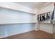 Spacious walk-in closet featuring ample shelving, and carpeted floors at 3574 E Glacier Pl, Chandler, AZ 85249