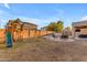 Expansive backyard featuring a playset, pool, and covered patio for outdoor entertaining at 4093 E Dublin St, Gilbert, AZ 85295