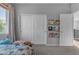 Bright bedroom featuring a window, closet, and playful decor at 4093 E Dublin St, Gilbert, AZ 85295