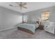 Comfortable bedroom with a ceiling fan, chair, and dual bedside tables offering a relaxed ambiance at 4093 E Dublin St, Gilbert, AZ 85295