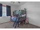 bedroom featuring bunk beds and a window with black out curtains at 4093 E Dublin St, Gilbert, AZ 85295