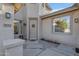 Charming front entrance with a decorative wreath, modern lighting, and stone accents at 4093 E Dublin St, Gilbert, AZ 85295
