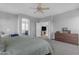 Spacious main bedroom with neutral tones, flowing into a bathroom and cozy living room area at 4093 E Dublin St, Gilbert, AZ 85295
