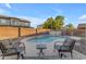 Relaxing backyard pool area with lounge seating, perfect for enjoying sunny days at 4093 E Dublin St, Gilbert, AZ 85295