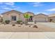 Charming single-story home with desert landscaping and a spacious two-car garage in a quiet neighborhood at 43271 W Little Dr, Maricopa, AZ 85138