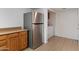 Bright kitchen with stainless steel refrigerator and adjacent laundry area at 4333 E Desert Cactus St, Phoenix, AZ 85032