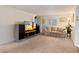 Comfortable living room with plush sofa and entertainment center, flooded with light at 4333 E Desert Cactus St, Phoenix, AZ 85032