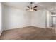 Bedroom featuring neutral carpet and bright white walls at 44574 W Garden Ln, Maricopa, AZ 85139