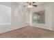 Bedroom with neutral carpet and multiple windows for optimal natural light at 44574 W Garden Ln, Maricopa, AZ 85139
