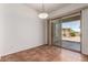 Bright dining area with tiled floors and sliding glass doors to the patio at 44574 W Garden Ln, Maricopa, AZ 85139