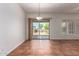 Inviting dining space with tile flooring and a sliding door to the landscaped backyard at 44574 W Garden Ln, Maricopa, AZ 85139