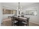 Inviting dining room with modern lighting, and seamless access to the living and kitchen area at 455 W Honeysuckle Dr, Chandler, AZ 85248