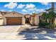 Charming home exterior featuring a well-manicured yard, and a two-car garage, creating excellent curb appeal at 455 W Honeysuckle Dr, Chandler, AZ 85248
