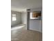 Well-lit living room with large window and breakfast bar, perfect for dining at 4628 E Wood St, Phoenix, AZ 85040