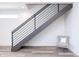 Contemporary staircase features wood treads, metal railing, and neutral decor, creating a clean and modern design at 512 S Soho Ln # 8, Chandler, AZ 85225
