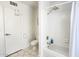 Bright bathroom with a shower/tub combo, white tile, and modern fixtures at 5309 W Dahlia Dr, Glendale, AZ 85304