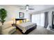 Comfortable bedroom with modern decor, ceiling fan, and access to outdoor patio at 5309 W Dahlia Dr, Glendale, AZ 85304