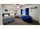 Bedroom with blue accents, two beds, decor and a comfortable beanbag chair at 5309 W Dahlia Dr, Glendale, AZ 85304