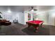 Spacious game room features a pool table, sitting area, and stylish decor at 5309 W Dahlia Dr, Glendale, AZ 85304