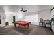 Open game room featuring a pool table, seating, and ample space for entertainment at 5309 W Dahlia Dr, Glendale, AZ 85304