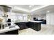 Stylish kitchen with stainless steel appliances, black cabinets, and white countertops at 5309 W Dahlia Dr, Glendale, AZ 85304