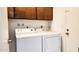 Functional laundry room equipped with a washer and dryer, ensuring convenient laundry tasks at 5309 W Dahlia Dr, Glendale, AZ 85304