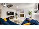 Modern living room with stylish decor, brick fireplace, large TV, and comfortable seating, perfect for relaxation at 5309 W Dahlia Dr, Glendale, AZ 85304