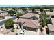 Birds-eye view of a well-maintained home with desert landscaping and a multi-car garage in a quiet neighborhood at 6030 W Topeka Dr, Glendale, AZ 85308