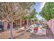 Outdoor oasis featuring a private pool, a covered patio with seating, a lush garden, and a bbq at 6030 W Topeka Dr, Glendale, AZ 85308