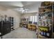 Spacious bedroom or flex space with a ceiling fan, shuttered windows, and ample space for storage at 6030 W Topeka Dr, Glendale, AZ 85308