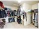 Spacious walk-in closet featuring extensive storage with shelving and hanging areas for clothing and accessories at 6030 W Topeka Dr, Glendale, AZ 85308