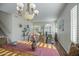Bright dining area with exercise equipment, hardwood flooring and tile flooring at 6030 W Topeka Dr, Glendale, AZ 85308