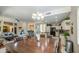 Bright, open-concept living space with modern furnishings, connecting kitchen and seating area at 6030 W Topeka Dr, Glendale, AZ 85308