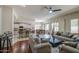 Open living room featuring neutral décor with bright views of the adjacent kitchen at 6030 W Topeka Dr, Glendale, AZ 85308