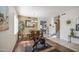 Bright living area with dining table, exercise equipment, and tile flooring at 6030 W Topeka Dr, Glendale, AZ 85308