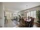 Bright living area with dining table, exercise equipment, and tile flooring at 6030 W Topeka Dr, Glendale, AZ 85308