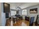 Functional home office with hardwood floors, neutral walls, window shutters, and built-in shelving at 6030 W Topeka Dr, Glendale, AZ 85308
