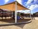 Neighborhood playground with shade canopy, play structure, and picnic area on a sunny day at 6030 W Topeka Dr, Glendale, AZ 85308