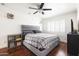 Cozy bedroom with hardwood floors, ceiling fan, and comfortable furnishings at 6522 E 2Nd St, Scottsdale, AZ 85251