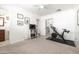 Spacious bedroom with a peloton machine and slider closet with mirrored doors at 6522 E 2Nd St, Scottsdale, AZ 85251
