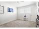 Bright bedroom featuring neutral carpet, white walls and a cute unicorn desk at 6522 E 2Nd St, Scottsdale, AZ 85251