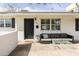 Welcoming front porch with stylish outdoor furniture, creating a cozy and inviting entrance at 6522 E 2Nd St, Scottsdale, AZ 85251