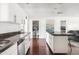 Bright kitchen with white cabinetry, island with breakfast bar, and stainless steel appliances at 6522 E 2Nd St, Scottsdale, AZ 85251