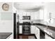 Modern kitchen with stainless steel appliances and sleek cabinetry, designed for functionality and style at 6522 E 2Nd St, Scottsdale, AZ 85251
